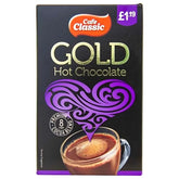 Box of Cafe Classic - Gold Hot Chocolate - 8 x 25g, with a purple heart, glass of cocoa, and label showing "8 cups premium cocoa blend" and £1.19. Includes convenient packets for easy hot chocolate enjoyment.